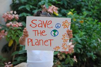 Person Holding Save the Planet
